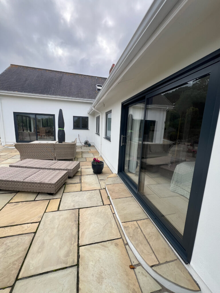dark-navy-aluminium-sliding-doors-from-origin-on-patio